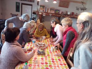 Learning the stitch from knitting expert, Karen.