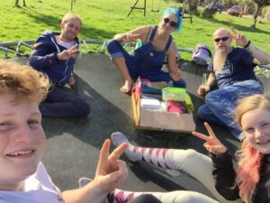 Opening my birthday presents on the trampoline